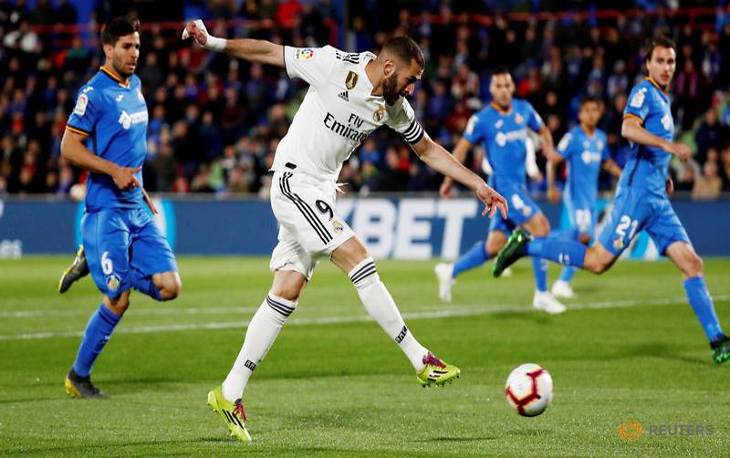 karim benzema skewed wide of the far post with 62 seconds on the clock and madrid hardly created a better chance for the rest of the half photo afp