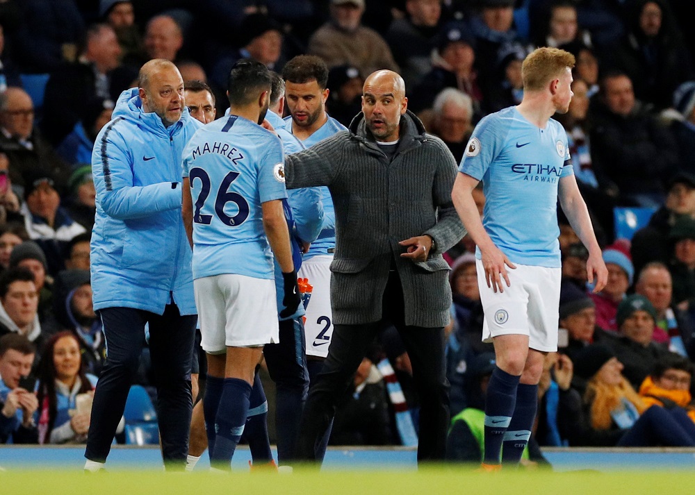 city are not in action until sunday when they travel to burnley and manager pep guardiola is wary of his side getting too over excited at clearing what was expected to be the toughest hurdle left at old trafford on wednesday photo afp