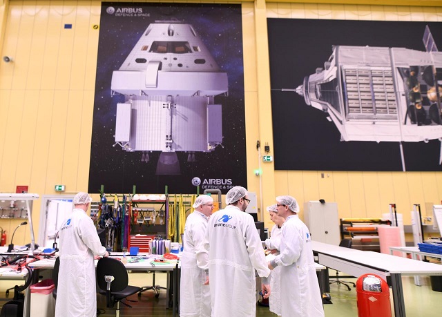 employees chat at a production line of airbus 039 european service module esm which is delivered for nasa 039 s orion spaceship at the airbus plant in bremen germany february 19 2019 photo reuters