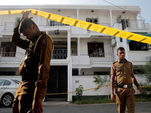 police keep watch outside the family home of a bomber suspect where an explosion occurred during a special task force raid following a string of suicide attacks on churches and luxury hotels in colombo photo reuters police keep watch outside the family home of a bomber suspect where an explosion occurred during a special task force raid following a string of suicide attacks on churches and luxury hotels in colombo photo reuters