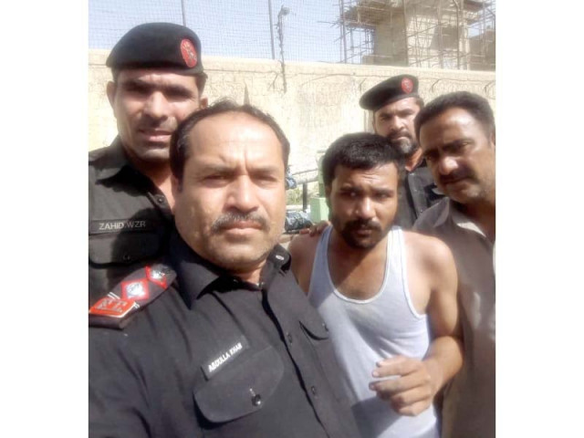 fc officials pose for a selfie with the inmate who was attempting to escape from the prison on wednesday morning photo express fc officials pose for a selfie with the inmate who was attempting to escape from the prison on wednesday morning photo express