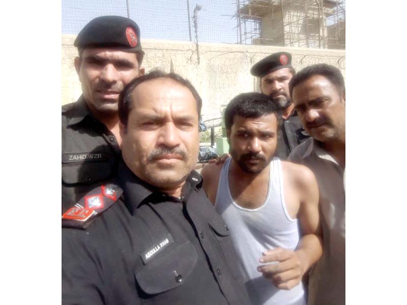 fc officials pose for a selfie with the inmate who was attempting to escape from the prison on wednesday morning photo express