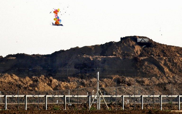 this picture from march 22 2019 shows balloons carrying a make shift drone shaped object flying over the border with israel east of gaza city after it was launched by palestinians during clashes along the security fence photo afp this picture from march 22 2019 shows balloons carrying a make shift drone shaped object flying over the border with israel east of gaza city after it was launched by palestinians during clashes along the security fence photo afp