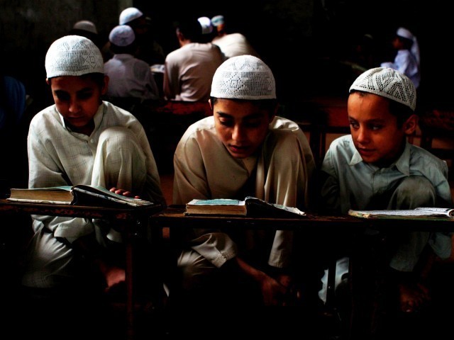 students reading at an islamic seminary photo express file