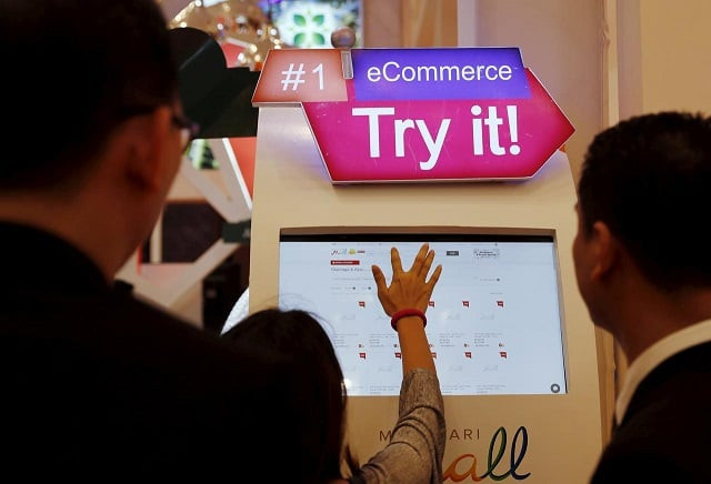 a woman use a touch screen to access a commerce application during indonesia e commerce summit amp expo at serpong district near jakarta indonesia april 27 2016 photo reuters a woman use a touch screen to access a commerce application during indonesia e commerce summit amp expo at serpong district near jakarta indonesia april 27 2016 photo reuters