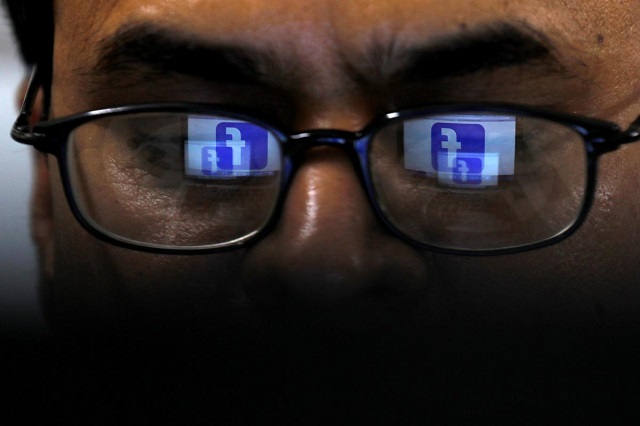 facebook logo is reflected in glasses in this picture illustration taken april 1 2019 photo reuters