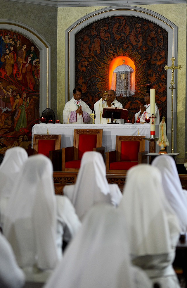 sri lankan catholic archbishop of colombo malcolm ranjith c prays during a private mass at the archbishop 039 s house church in colombo photo afp