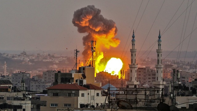 a picture taken on july 20 2018 shows a fireball exploding in gaza city during israeli bombardment photo afp