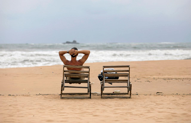 a tourist rests on a beach near hotels in a tourist area in bentota sri lanka may 2 2019 picture take may 2 2019 photo reuters