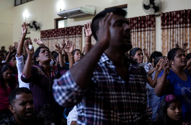 members of zion church which was bombed on easter sunday pray at a community hall in batticaloa photo reuters