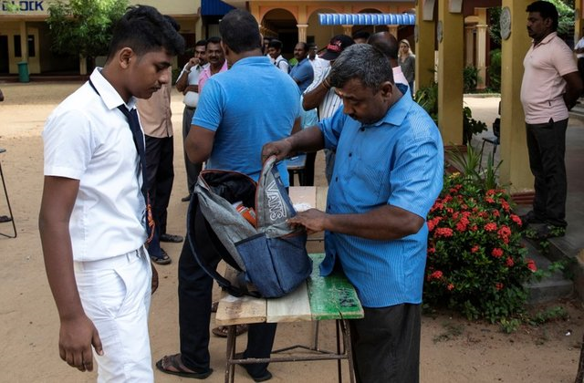 a student 039 s bag is searched by a parent as he arrives at his school which opened days after a string of suicide bomb attacks across the island on easter sunday in batticaloa sri lanka may 6 2019 photo reuters a student 039 s bag is searched by a parent as he arrives at his school which opened days after a string of suicide bomb attacks across the island on easter sunday in batticaloa sri lanka may 6 2019 photo reuters