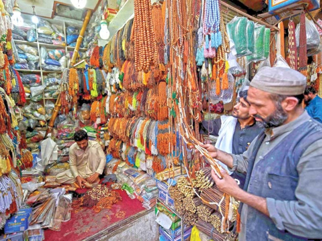 people select tasbeeh at a shop in peshawar on monday at the start of the holy month of ramazan photo afp people select tasbeeh at a shop in peshawar on monday at the start of the holy month of ramazan photo afp