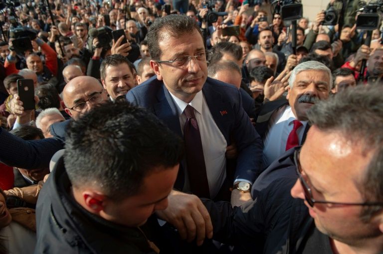 cheering supporters packed the streets to greet opposition candidate ekrem imamoglu c at the istanbul court where he received his mandate certificate photo afp