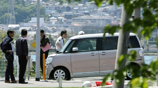 police said the car veered onto the pavement after making 039 contact 039 with another larger vehicle photo afp police said the car veered onto the pavement after making 039 contact 039 with another larger vehicle photo afp