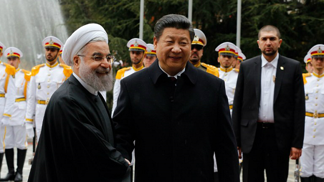 iranian president hassan rouhani shakes hands with chinese president xi jinping r during a welcoming ceremony on january 23 2016 in the iranian capital tehran photo afp