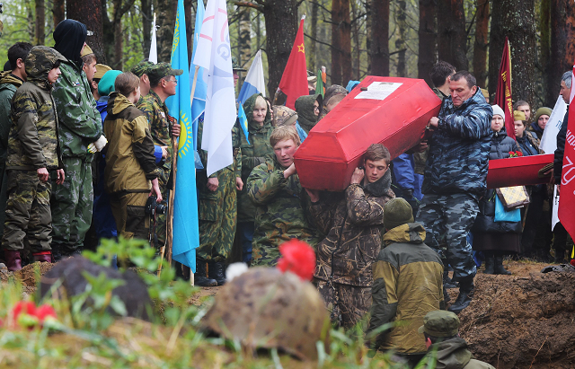 members of volunteer search groups carry coffins with the remains of red army soldiers killed in world war two into a mass grave during a reburial ceremony at the sinyavino heights memorial site outside saint petersburg photo afp members of volunteer search groups carry coffins with the remains of red army soldiers killed in world war two into a mass grave during a reburial ceremony at the sinyavino heights memorial site outside saint petersburg photo afp