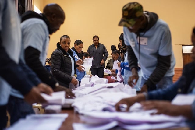 a south african ruling party african national congress anc party representative overlooks independent electoral commission iec staff members folding ballot papers at the brixton recreational centre voting station in brixton johannesburg as part of the vote for south african general elections on may 8 2019 photo afp a south african ruling party african national congress anc party representative overlooks independent electoral commission iec staff members folding ballot papers at the brixton recreational centre voting station in brixton johannesburg as part of the vote for south african general elections on may 8 2019 photo afp