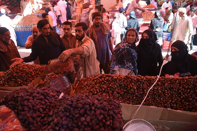 citizens buying dates at a market in karachi photo afp