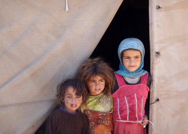 girls stand at the entrance to their tent at a camp for internally displaced people in the northwestern city of saada yemen january 30 2017 photo reuters