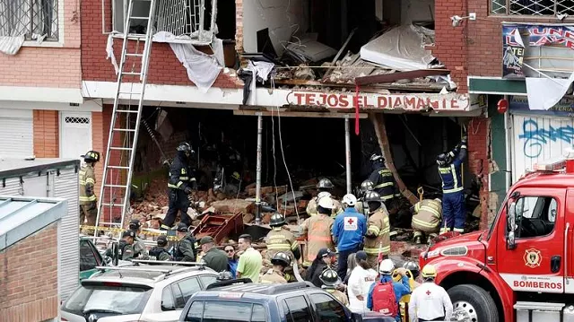fire fighters and rescue workers inspect the damage at a factory in bogota where an explosion killed four people and left 29 injured photo afp fire fighters and rescue workers inspect the damage at a factory in bogota where an explosion killed four people and left 29 injured photo afp