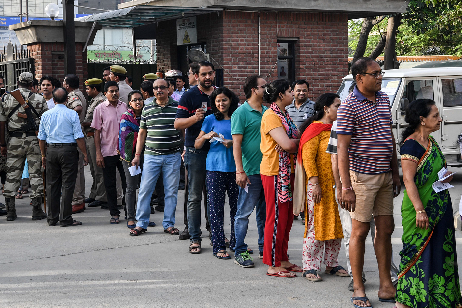 people line up to vote at a polling station during india 039 s general election in ghaziabad uttar pradesh on april 11 2019 photo afp