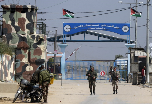 in this file photo hamas security forces stand guard at erez border crossing into israel in the northern gaza strip on march 26 2017 photo afp in this file photo hamas security forces stand guard at erez border crossing into israel in the northern gaza strip on march 26 2017 photo afp