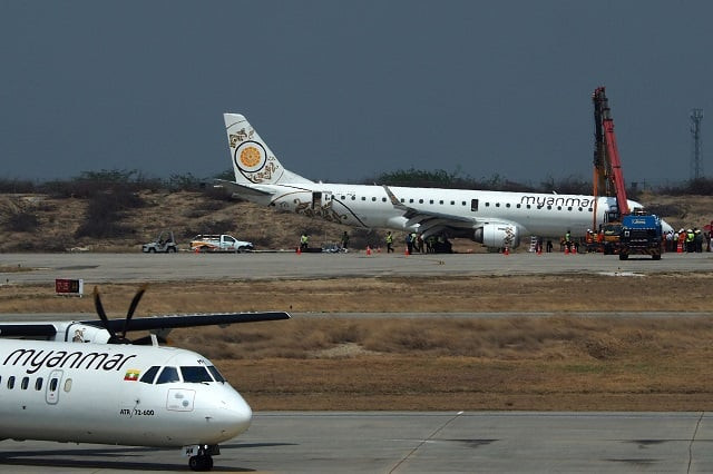 a general view shows a myanmar national airlines passenger plane after an emergency landing at mandalay international airport on may 12 2019 photo str afp a general view shows a myanmar national airlines passenger plane after an emergency landing at mandalay international airport on may 12 2019 photo str afp