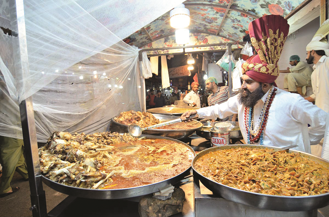 a vendor displaying and selling traditionally food stuff for sehri at kartarpura during holy fasting month of ramazan photo app