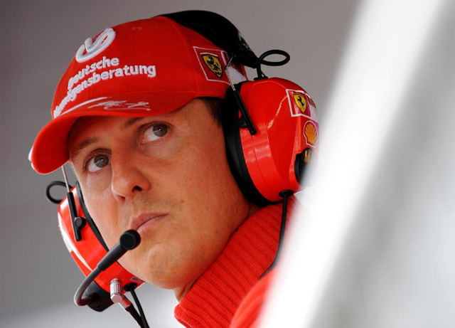 former ferrari driver michael schumacher of germany looks on during the qualifying session for the italian f1 grand prix race at the monza racetrack in monza near milan in this september 13 2008 file photo reuters alessandro bianchi