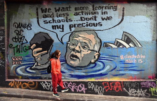 mural in melbourne shows australian prime minister scott morrison holding a lump of coal as it advertises a rally by students around the world to protest climate change photo afp mural in melbourne shows australian prime minister scott morrison holding a lump of coal as it advertises a rally by students around the world to protest climate change photo afp