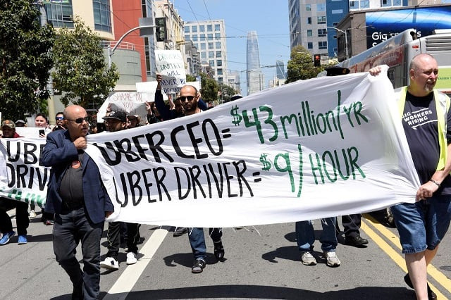 protestors march through the financial district demanding fair wages and more transparency during a strike against uber in san francisco california us may 8 2019 photo reuters protestors march through the financial district demanding fair wages and more transparency during a strike against uber in san francisco california us may 8 2019 photo reuters