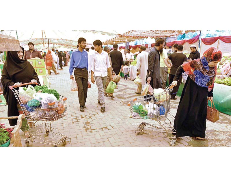 people purchasing groceries from sasta bazaar in shamsabad rawalpindi photo app