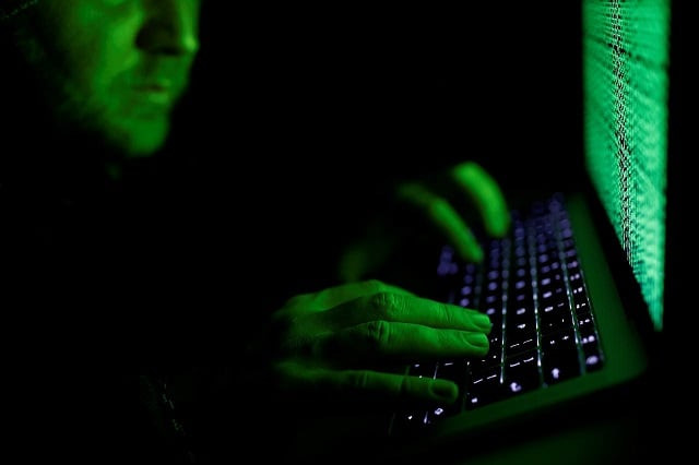 a man types on a computer keyboard in front of the displayed cyber code in this illustration picture taken on march 1 2017 photo reuters a man types on a computer keyboard in front of the displayed cyber code in this illustration picture taken on march 1 2017 photo reuters