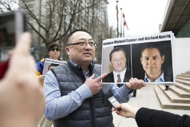 china formally arrests canadian ex diplomat businessman report