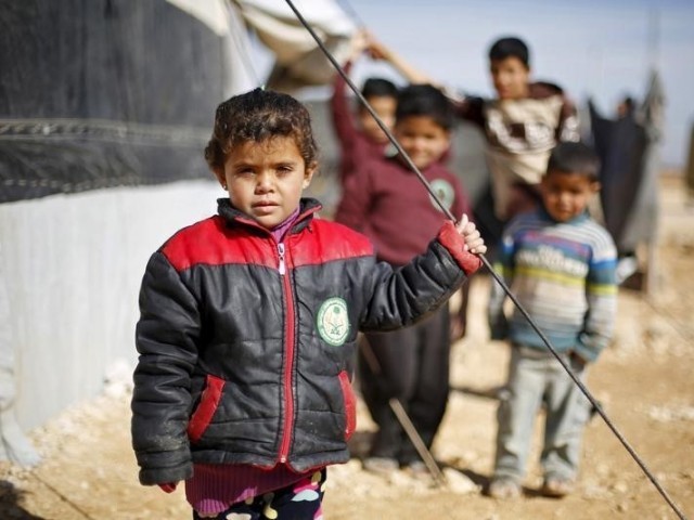 syrian refugee children pose as they play near their families 039 residence at al zaatari refugee camp in the jordanian city of mafraq near the border with syria january 30 2016 photo reuters