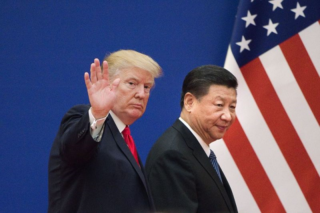 u s president donald trump and chinese president xi jinping leave an event at the great hall of the people in beijing on nov 9 2017 photo afp