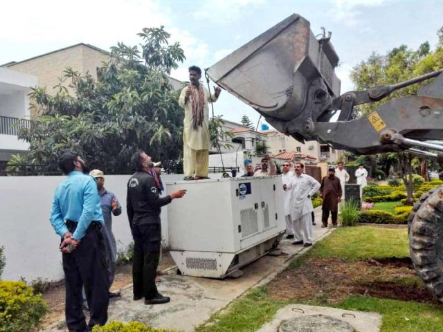 cda workers remove a generator from a footpath photo express cda workers remove a generator from a footpath photo express
