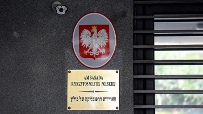 israeli charged for spitting at polish ambassador