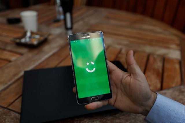 an employee shows the logo of ride hailing company careem on his mobile in his office in the west bank city of ramallah july 17 2017 picture taken july 17 2017 photo reuters