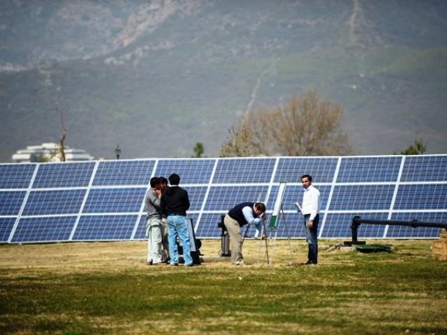 representational image of solar panels being installed photo afp