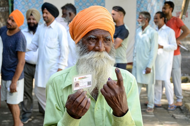 indian voter ajeet singh shows his ink marked finger after casting his vote during the 7th and final phase of india 039 s general election at a polling station in a village on the outskirts of amritsar on may 19 2019 photo afp