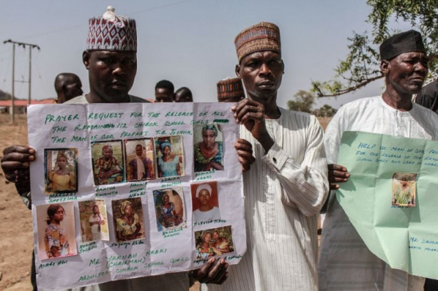 parents and relatives hold portraits of their girls during a commemoration five years after they were abducted by boko haram jihadists who stormed the chibok girls 039 boarding school photo afp parents and relatives hold portraits of their girls during a commemoration five years after they were abducted by boko haram jihadists who stormed the chibok girls 039 boarding school photo afp