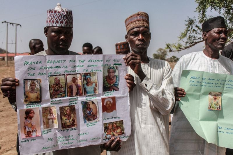 parents and relatives hold portraits of their girls during a commemoration five years after they were abducted by boko haram jihadists who stormed the chibok girls 039 boarding school photo afp