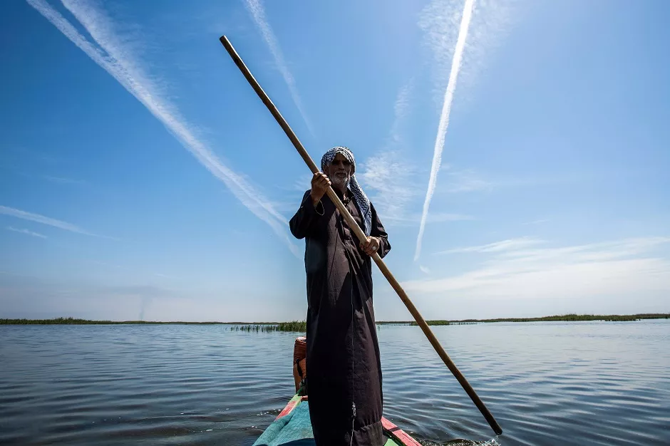1 abu hayder an iraqi ecotourism guide navigates a canoe in the marshes of the southern district of chibayish in dhi qar province about 120 kilometres northwest of the southern city of basra photo afp 1 abu hayder an iraqi ecotourism guide navigates a canoe in the marshes of the southern district of chibayish in dhi qar province about 120 kilometres northwest of the southern city of basra photo afp