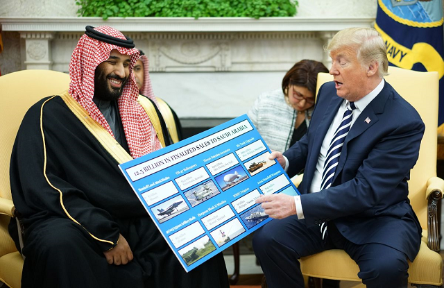 us president donald trump looks at a defense sales chart with saudi arabia 039 s crown prince mohammed bin salman in the oval office of the white house on march 20th 2018 photo afp