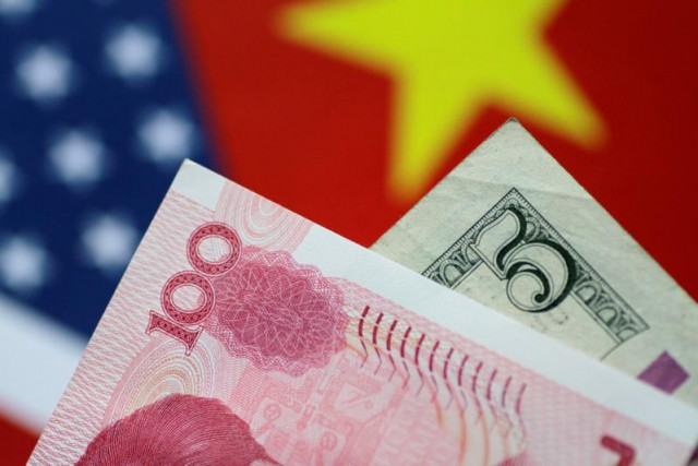 a reuters file photo of yuan and us dollar photo reuters a reuters file photo of yuan and us dollar photo reuters
