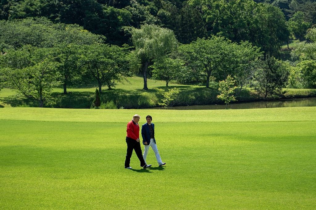 donald trump and japanese pm shinzo abe headed to the golf course before the more formal parts of the us president 039 s visit photo afp