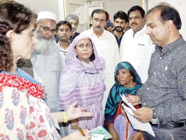 dr azra pechuho enquires about the health of patients during her visit to chandka medical college hospital in larkana on tuesday photo ppi file