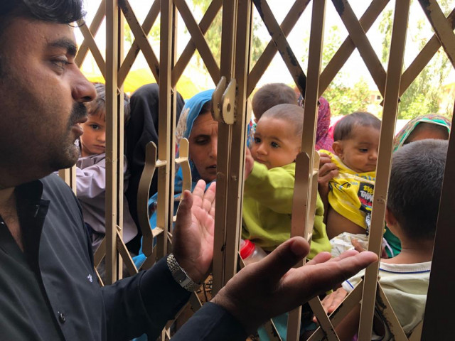 long lines women and children waited for several hours at rato dero taluka hospital to be allowed inside the facility where they would be tested for hiv as thousands made their way to the screening camps authorities found it difficult to manage the influx photo express