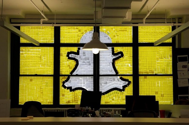 an image of the snapchat logo created with post it notes is seen in the windows of havas worldwide at 200 hudson street in lower manhattan new york u s may 18 2016 where advertising agencies and other companies have started what is being called a quot post it note war quot with employees creating colorful images in their windows with post it notes photo reuters